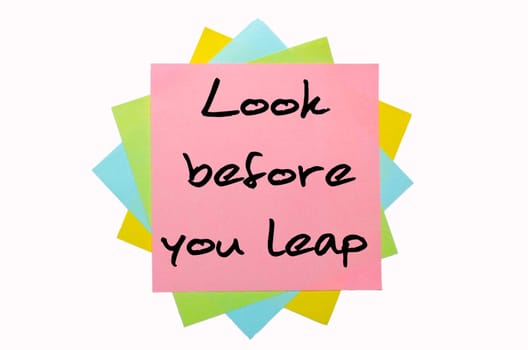 text "Look before you leap"" written by hand font on bunch of colored sticky notes"