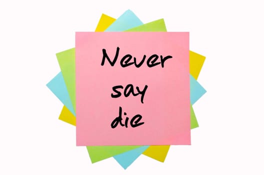 text " Never say die "" written by hand font on bunch of colored sticky notes"