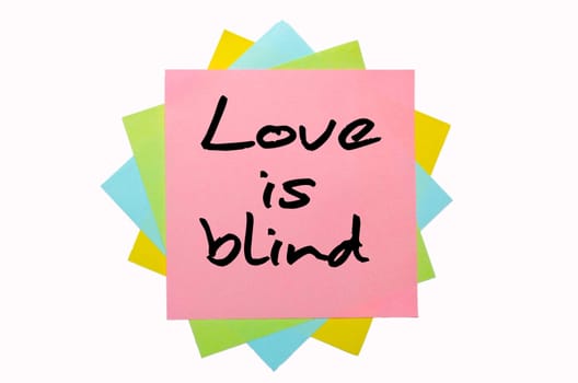 text "Love is blind"" written by hand font on bunch of colored sticky notes"