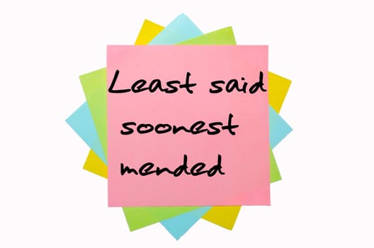 text "Least said soonest mended"" written by hand font on bunch of colored sticky notes"