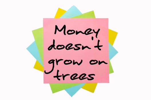 text "Money doesn&#039 t grow on trees"" written by hand font on bunch of colored sticky notes"
