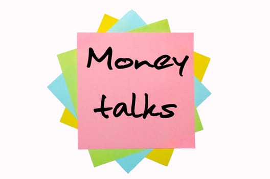 text "Money talks"" written by hand font on bunch of colored sticky notes"