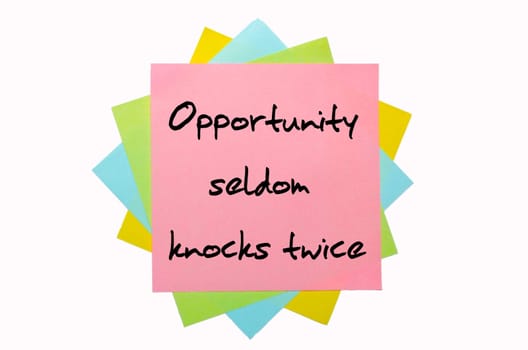 text " Opportunity seldom knocks twice "" written by hand font on bunch of colored sticky notes"