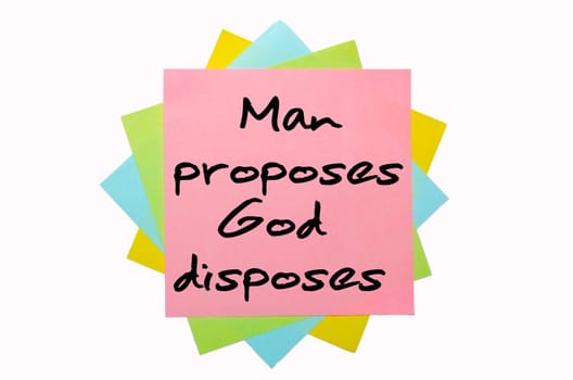 text "Man proposes, God disposes"" written by hand font on bunch of colored sticky notes"