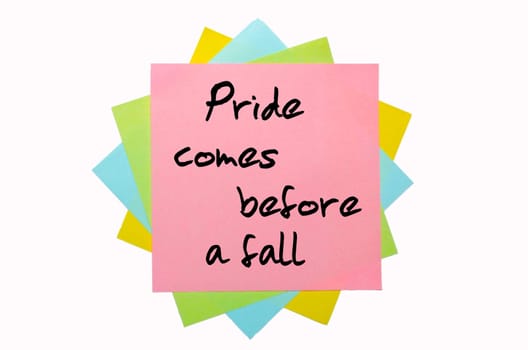 text " Pride comes before a fall "" written by hand font on bunch of colored sticky notes"