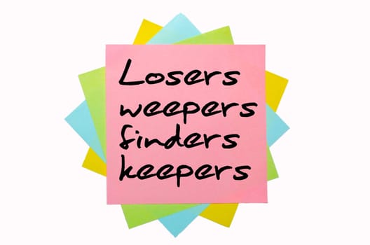 text "Losers weepers, finders keepers"" written by hand font on bunch of colored sticky notes"