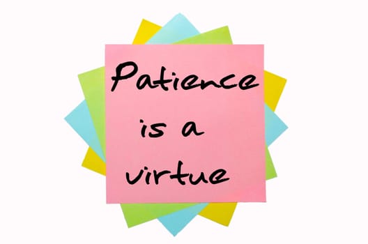 text "Patience is a virtue"" written by hand font on bunch of colored sticky notes"