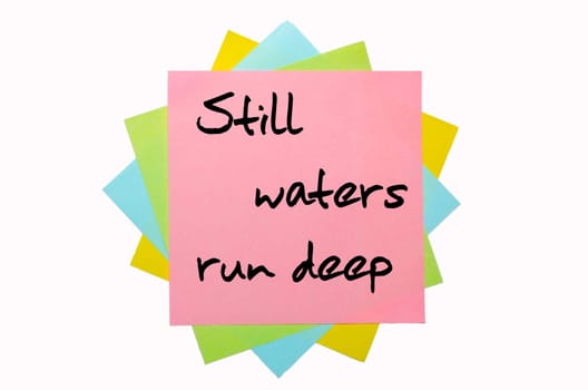 text " Still waters run deep "" written by hand font on bunch of colored sticky notes"