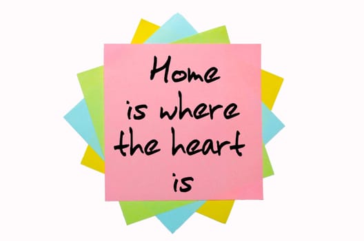 text "  Home is where the heart is "" written by hand font on bunch of colored sticky notes"