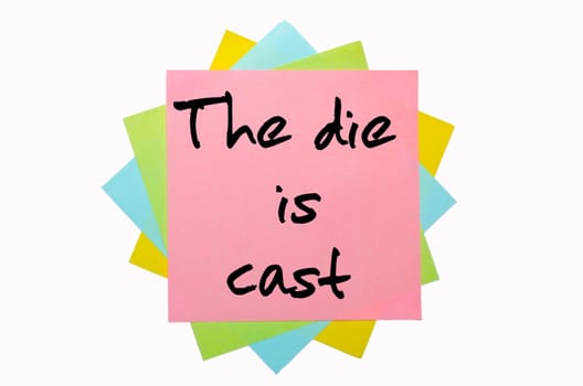 text " The die is cast "" written by hand font on bunch of colored sticky notes"