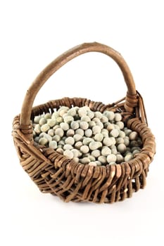 dried green peas in a basket