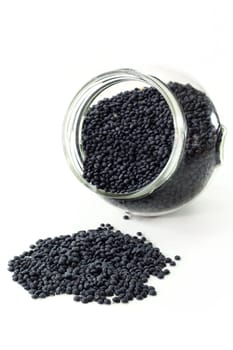 a jar of beluga lentils against a white background