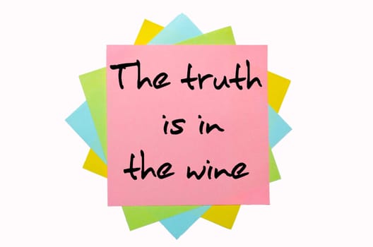 text " The truth is in the wine "" written by hand font on bunch of colored sticky notes"
