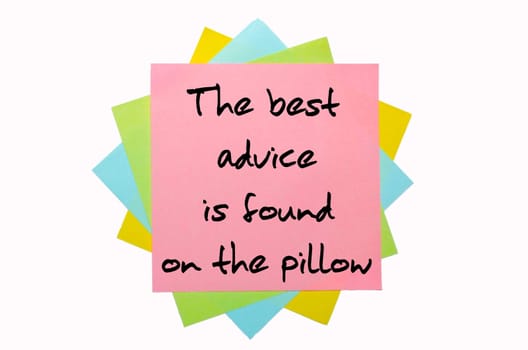 text " The best advice is found on the pillow "" written by hand font on bunch of colored sticky notes"