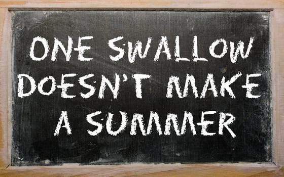 Blackboard writings "One swallow doesn&#039 t make a summer"""