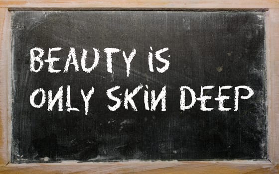 Blackboard writings "Beauty is only skin deep"""