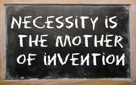 Blackboard writings "Necessity is the mother of invention"""