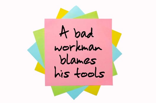 text "A bad workman blames his tools"" written by hand font on bunch of colored sticky notes"