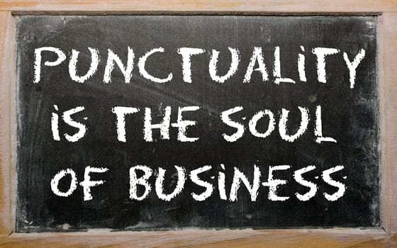Blackboard writings "Punctuality is the soul of business"""