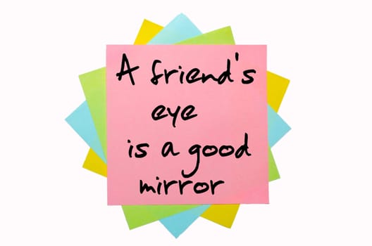 text "A friend&#039 s eye is a good mirror"" written by hand font on bunch of colored sticky notes"