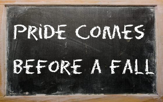 Blackboard writings "Pride comes before a fall"""
