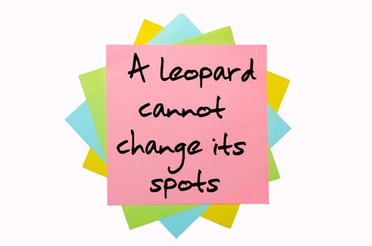 text "A leopard cannot change its spots"" written by hand font on bunch of colored sticky notes"