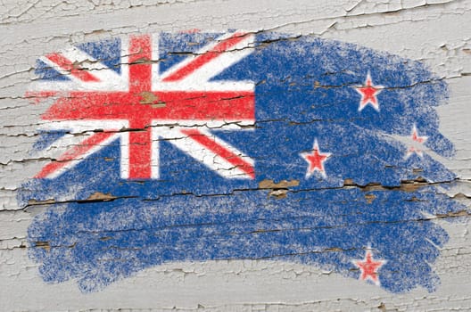 Chalky new zealand flag painted with color chalk on grunge wooden texture