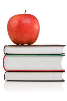 stack of books with a red apple on the top