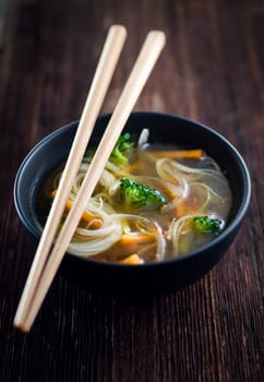 Fresh asian vegetable soup with noodles close up