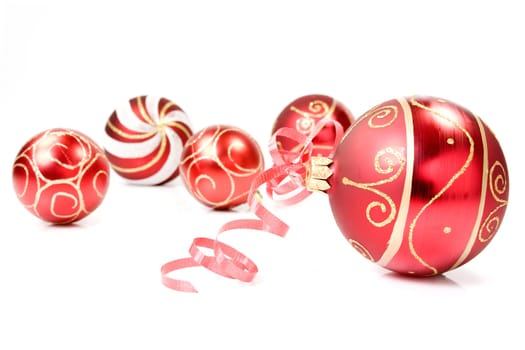 red christmas baubles over a white background
