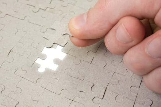 puzzle piece coming down into it&#039 s place