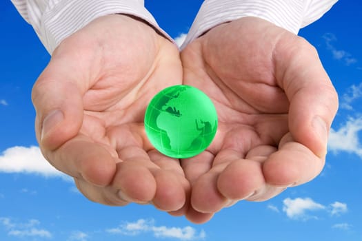 saving earth concept photo with hands holding a globe on the sky background