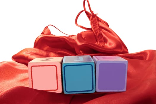 blank blocks for text on a silk nightie against white background