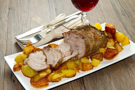 roast beef sliced with potatoes