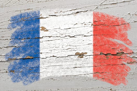 Chalky frech flag painted with color chalk on grunge wooden texture