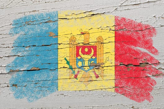 Chalky moldova flag painted with color chalk on grunge wooden texture