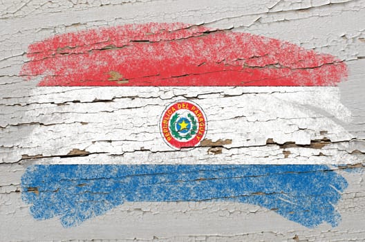 Chalky paraguay flag painted with color chalk on grunge wooden texture