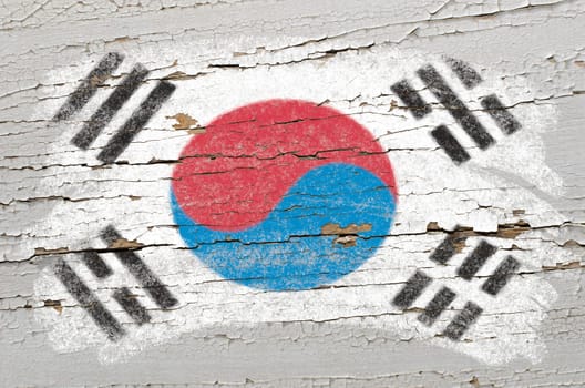 Chalky south korean flag painted with color chalk on grunge wooden texture