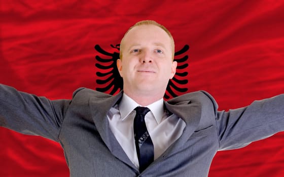 joyful investor spreading arms after good business investment in albania