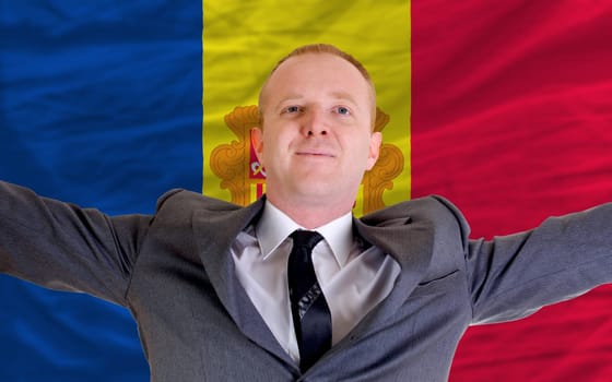 joyful investor spreading arms after good business investment in andora