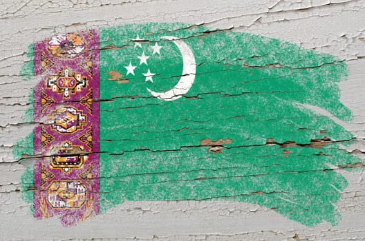 Chalky turkmenistan flag painted with color chalk on grunge wooden texture