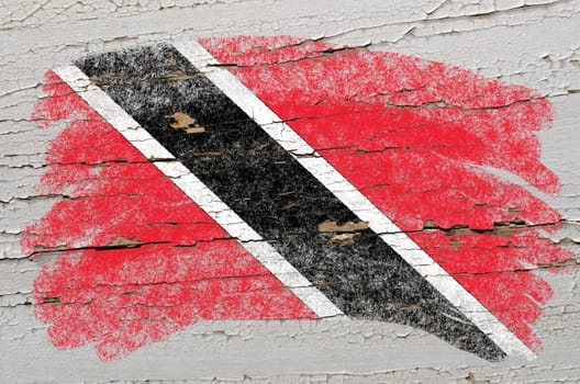 Chalky trinidad and tobago flag painted with color chalk on grunge wooden texture