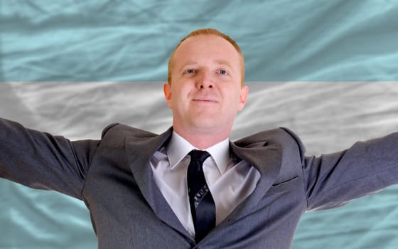 joyful investor spreading arms after good business investment in argentina
