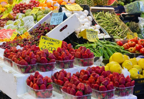 Colourful fruit and vegetable market stall in Boqueria market in Barcelona.