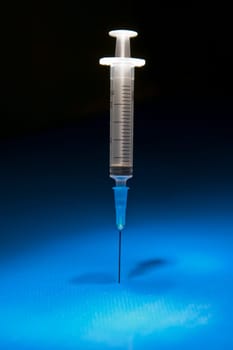 Ready and isolated medical syringe standing head down