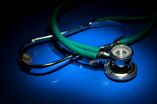 Isolated green stethoscope waiting for patients to inspect