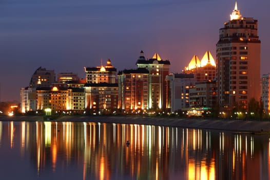 Modern illuminated waterfront at ishim River Astana Kazakhstan