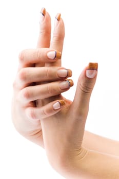 Beautiful female well-groomed colorful fingernails against white background