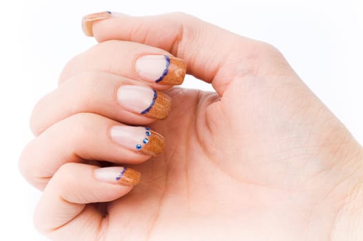 Beautiful female well-groomed colorful fingernails against white background