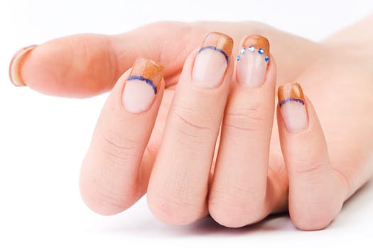 Beautiful female well-groomed colorful fingernails against white background